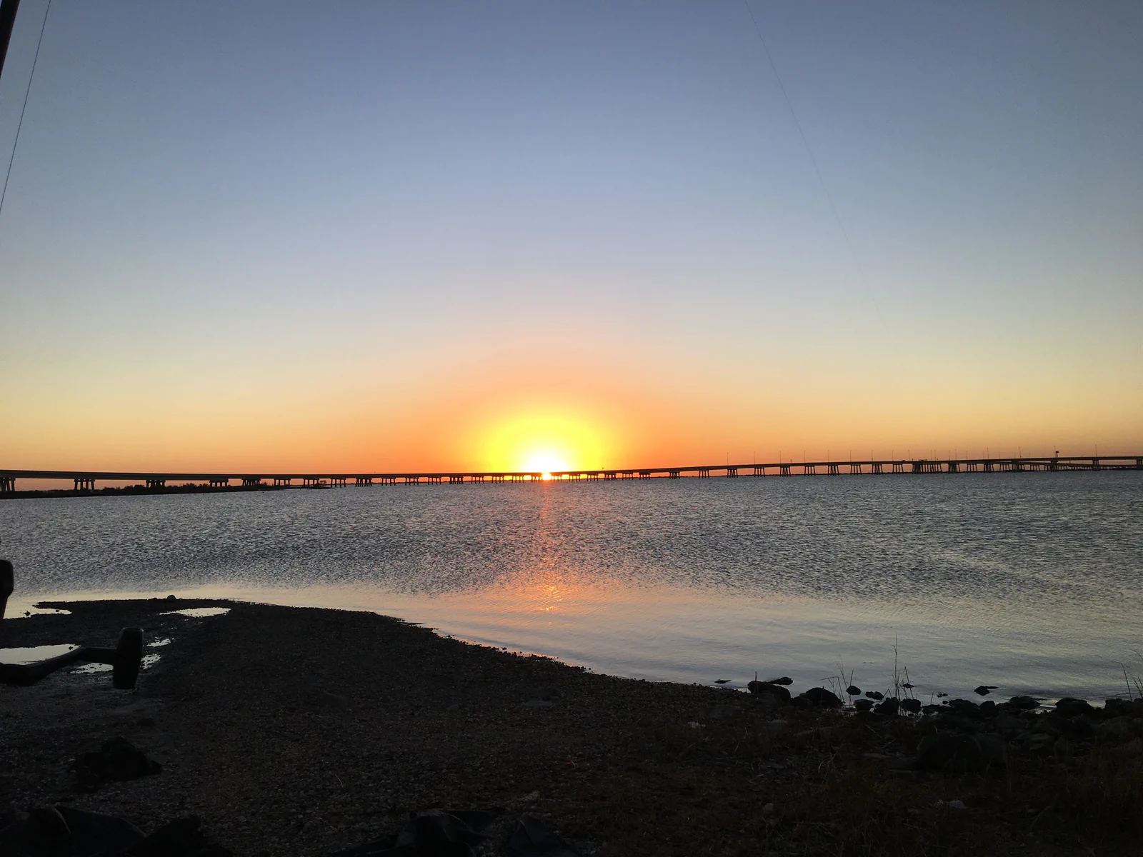 Long bridge over Southeast Louisiana water at sunset