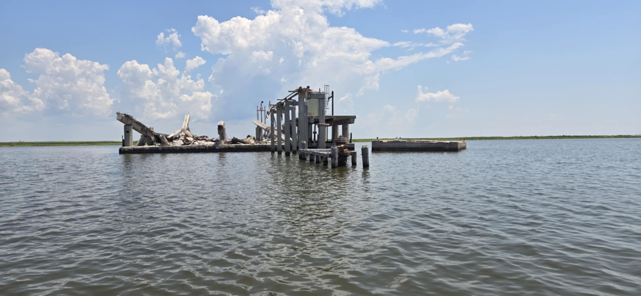 Broken inshore structure surrounded by open South Louisiana water
